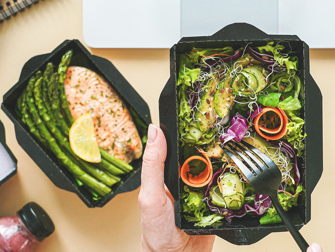 Female,Hands,Hold,Food,Delivery,Box,Having,Lunch,At,Work
