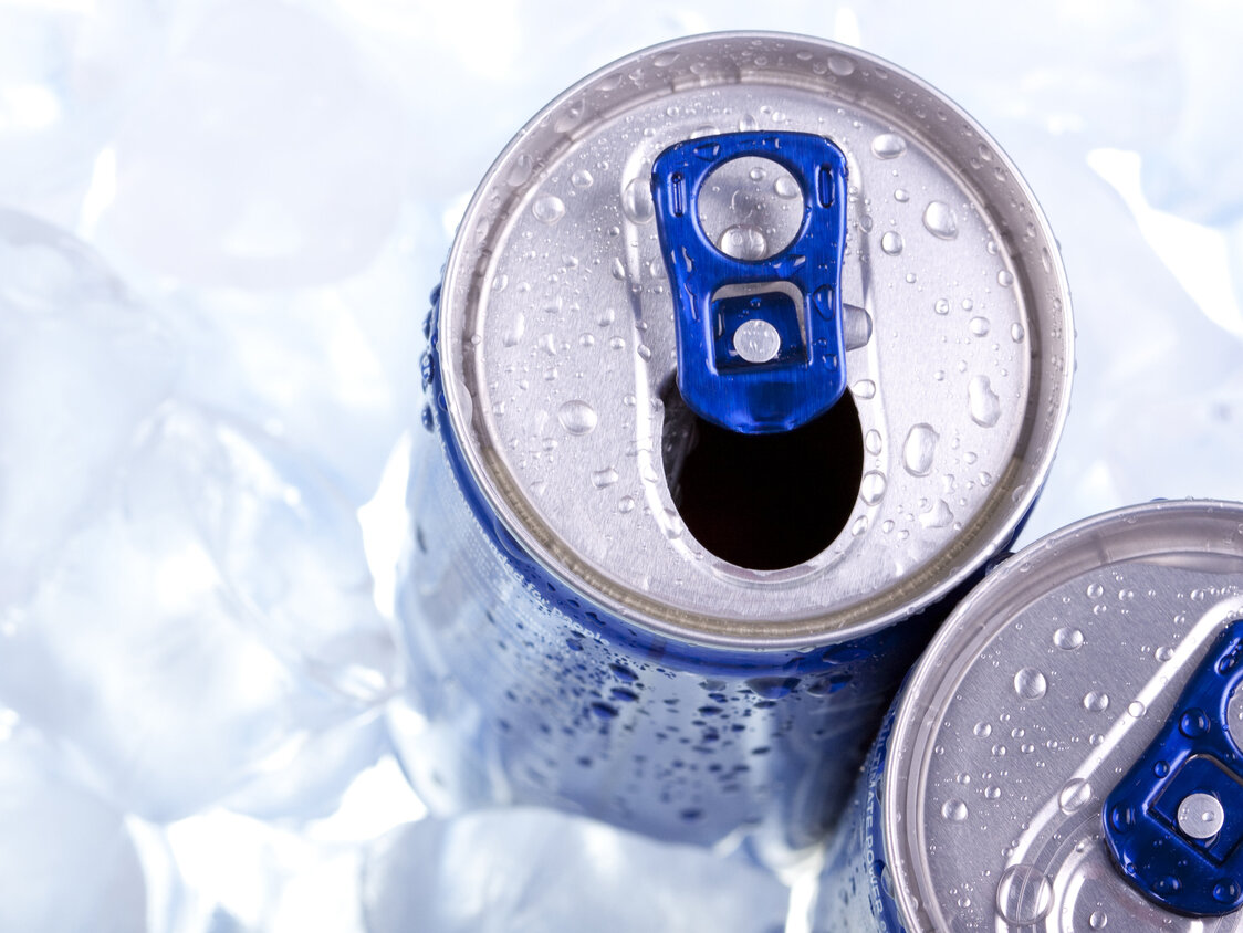 Closeup,Of,Blue,Drink,Can,On,Ice,Background