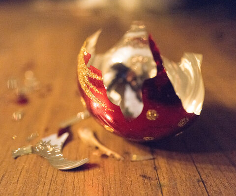 Broken Christmas bauble on floor