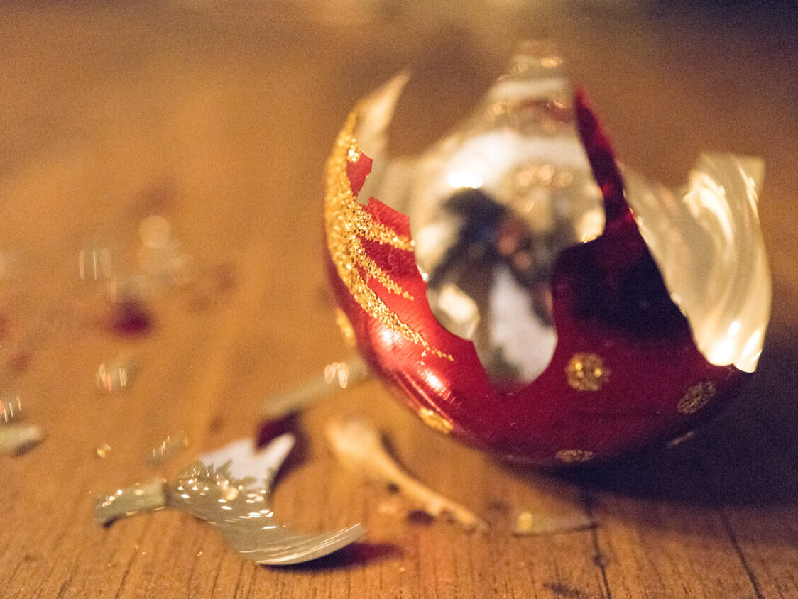 Broken Christmas bauble on floor