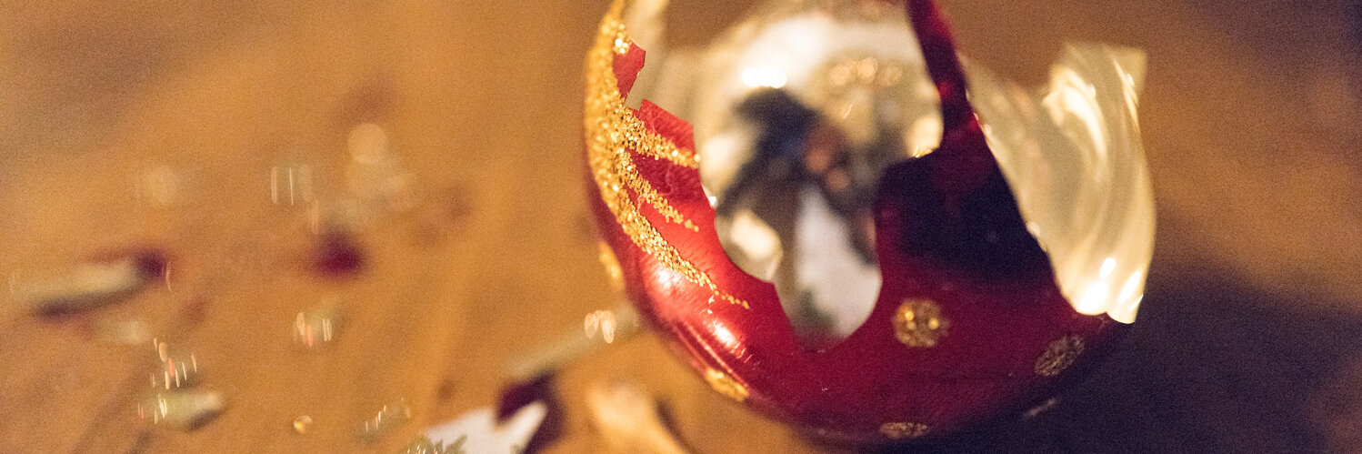 Broken Christmas bauble on floor